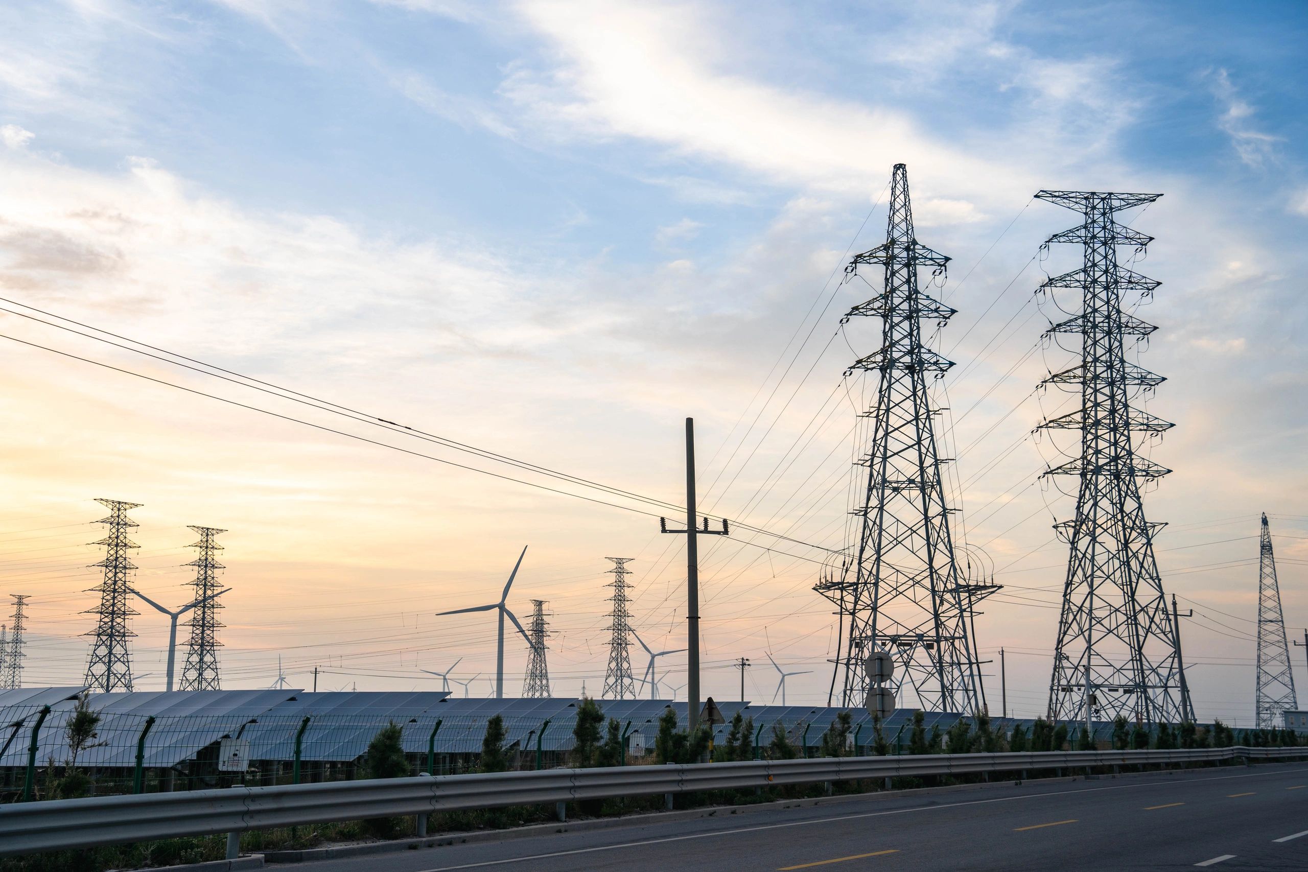 Wind Solar and Power Grid Infrastructure at Dusk